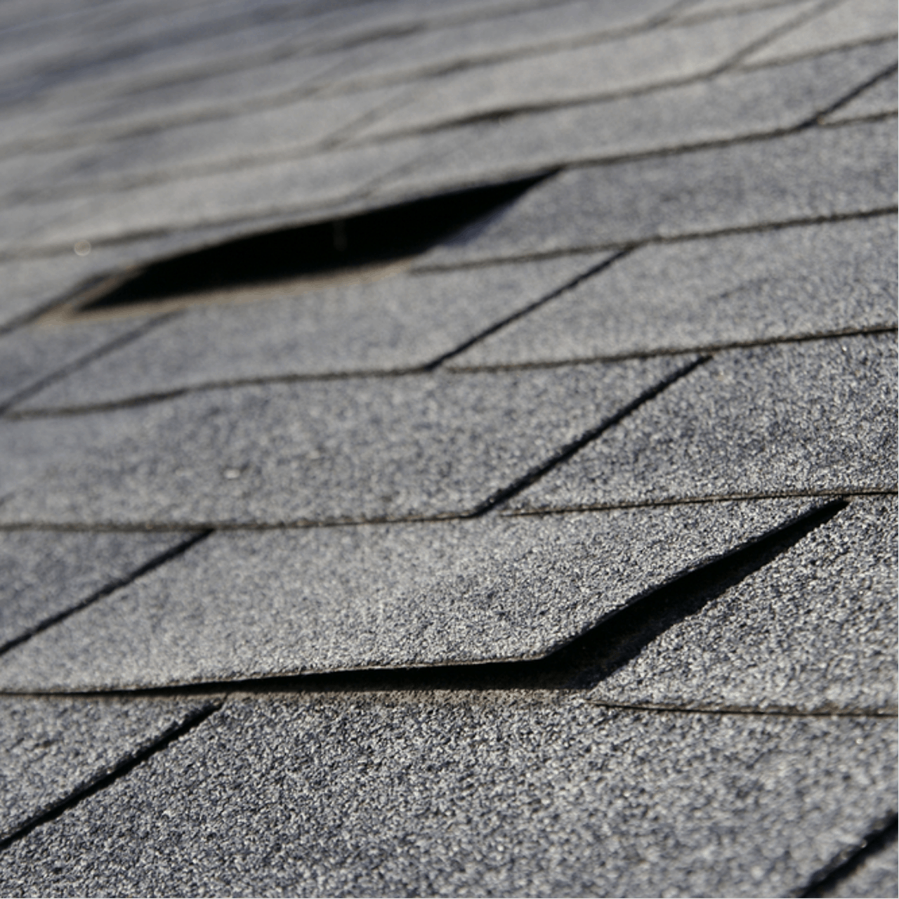 loose shingles from wind damage