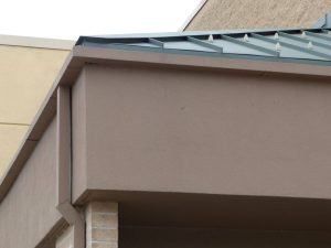 a commercial roof with gutters
