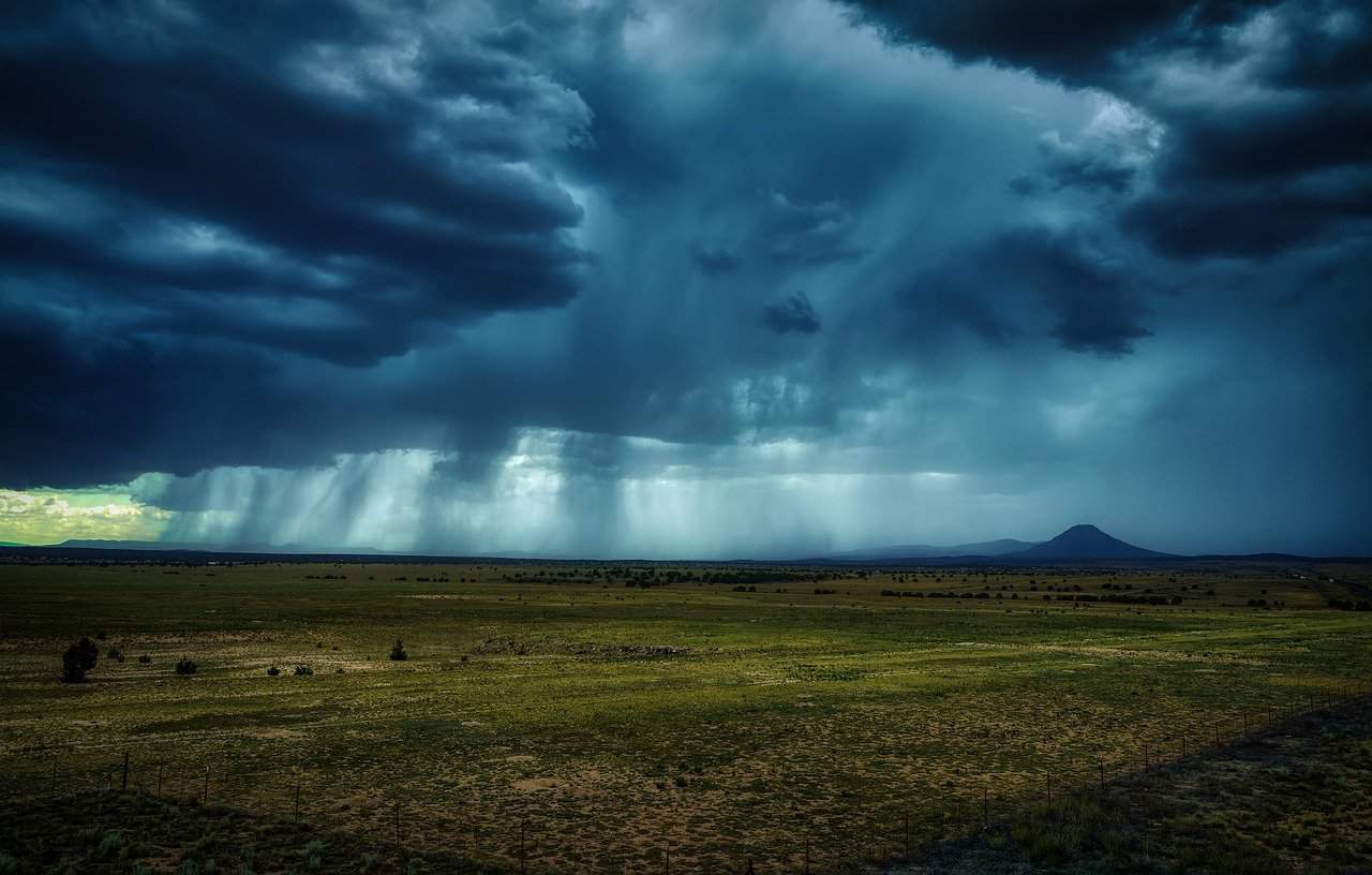 storm clouds gather over an Arizona landscape
