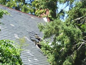 a badly damaged roof in need of emergency roofing repairs