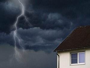a storm looms in the background of a roof