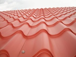 closeup of a red metal residential roof
