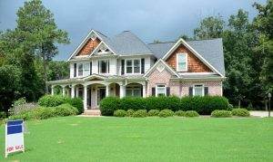 a large home for sale with a new roof that increases its value