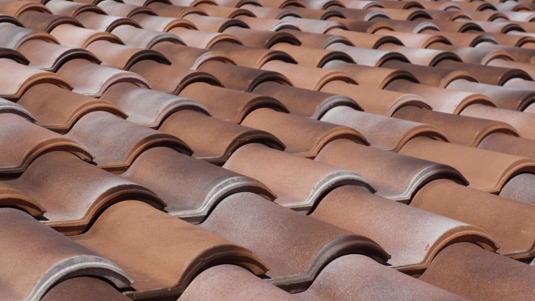 closeup of a tile roof that may be in need of a lift and relay