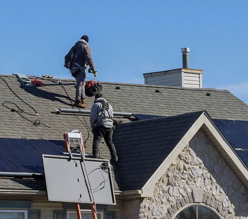 Crew installing solar panels