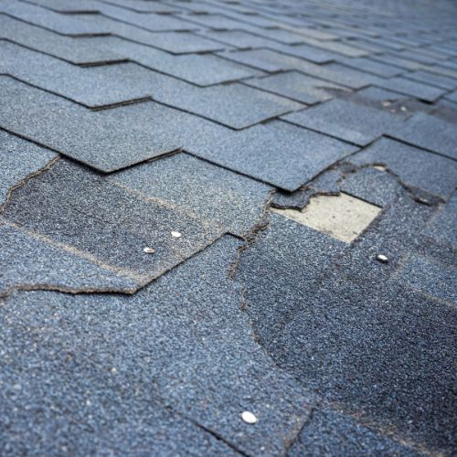 shingles missing from roof likely as a result of wind damage